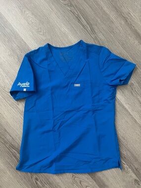 Figs V-Neck Scrub Top in Royal Blue with Aya Healthcare Sleeve Logo